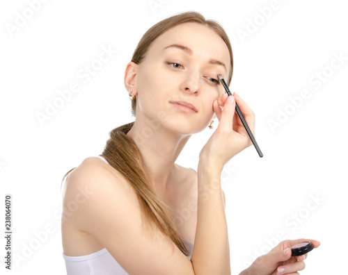 Beautiful woman beauty fashion eyeshadow brush in hand on white background isolation