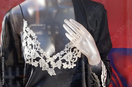 Mannequin's breast in white lace lingerie close-up