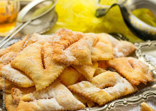 Photos Traditional sweet crisp Angel wings with powdered sugar and rum
