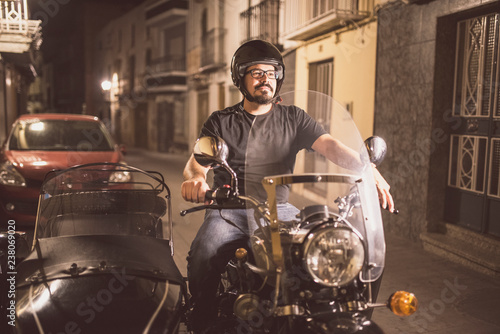 Young man driving sidecar in the street