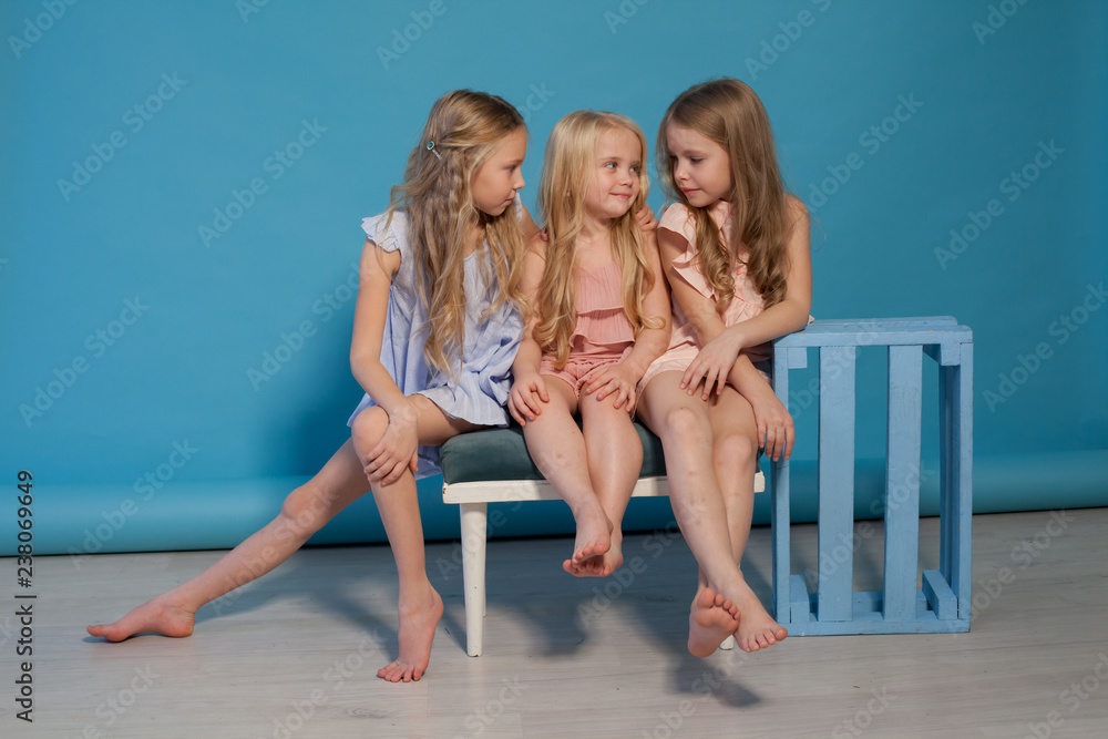 three beautiful little girls dresses fashion portrait sisters foto