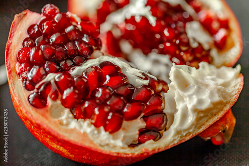 Delicious pomegranate fruit wiating to be eaten. photo