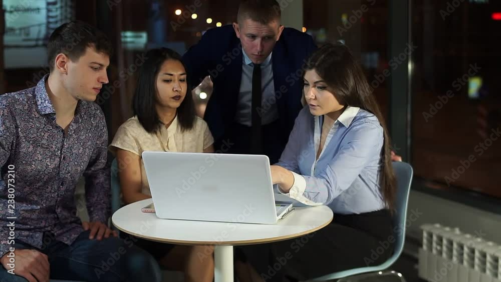 Office staff communicate with a laptop in the office comes an evil woman and throws the paper on the table. Office staff communicate with a laptop in the office comes an evil woman and throws the paper on the table.