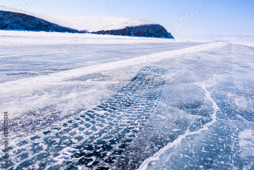 Baikal lake ice road under the scorching sun