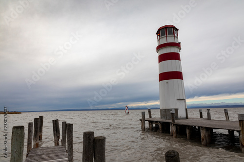 wooden pier with lighthouse in podersdorf on lake neusiedl in austria
