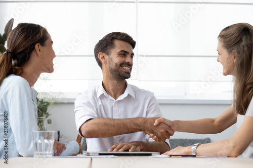 Executive manager greeting investor before start negotiations. Successful businesspeople make deal shake hands feel happy. Handshaking is hand gesture business etiquette, symbol of and trust respect © fizkes