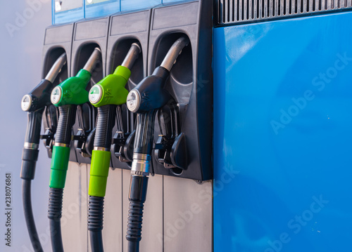 Different Fuel pistols at european Petrol station. 95,98,DD fuel pistols. Focus on the diesel DD & B7 pistol.