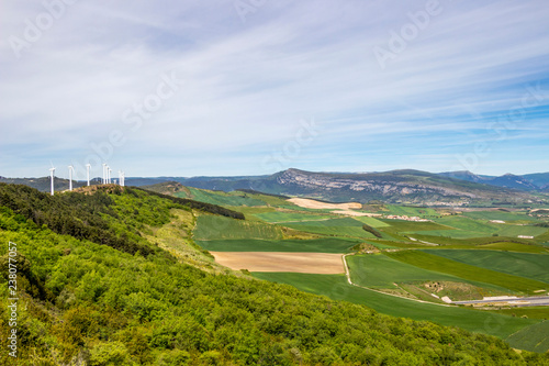 El Perdon mountain range view over the Pamplona basin with wind turbines in the distance, in Navarre, Spain