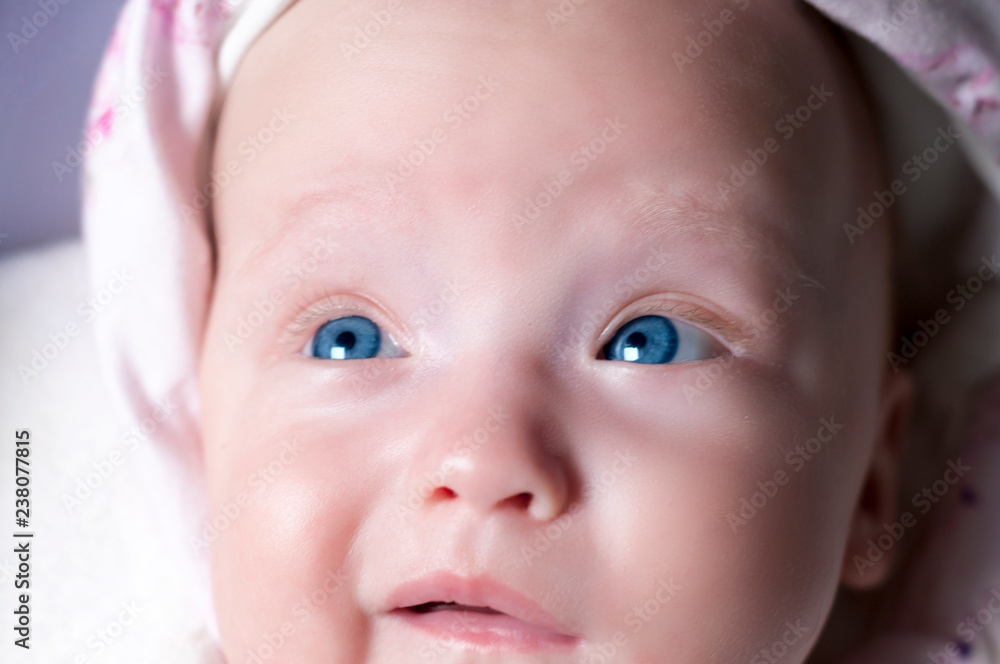 Beautiful newborn girl with amazing eyes. Surprised attentive glance. Selective focus. Beautiful newborn girl with amazing eyes. Surprised attentive glance. Selective focus.