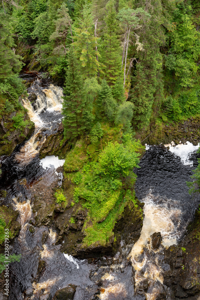 Plodda Falls - waterfall in scotland Plodda Falls - waterfall in scotland