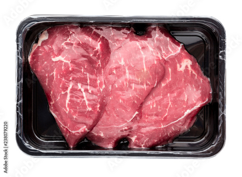 Vacuum-packed beef on a white background. Marbled beef from the store isolated on a white background.
