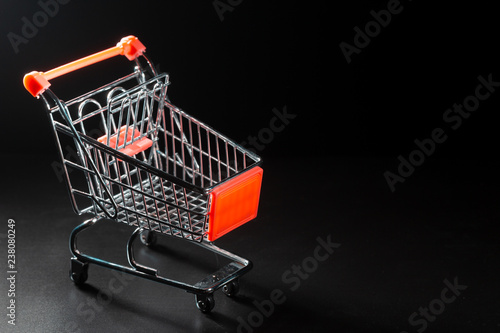 The cart from the supermarket on a black background