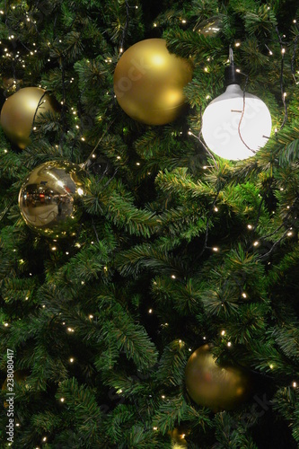 christmas tree in close-up look, full of decorations and lights, giving the atmosphere of magical christmas in december.
