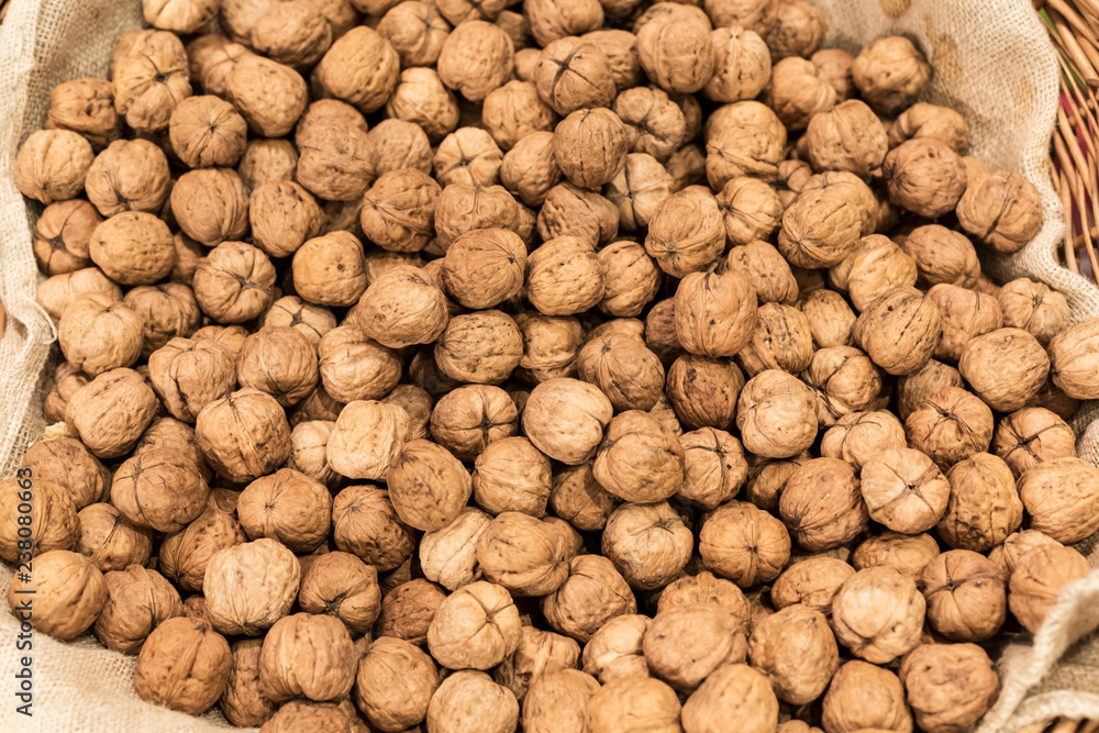 walnuts in rough canvas bag, view from above walnuts in rough canvas bag, view from above