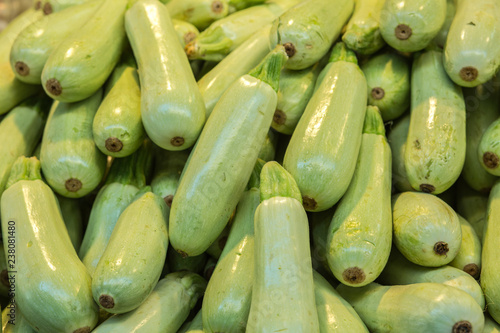 courgette  pile on a market background photo