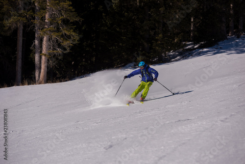 Skier having fun while running downhill