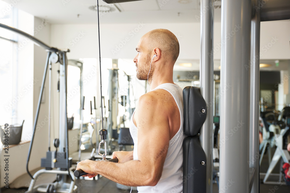 Middle aged man workout in the gym Middle aged man workout in the gym