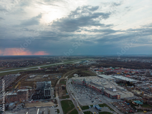 overcast weather. storm on sunset over city. © phpetrunina14