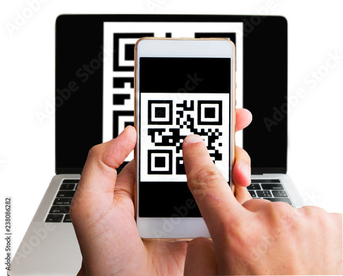 Wallpaper Mural Scanning qr code from laptop using phone, close up. Isolated on white. Internet cashless purchase Torontodigital.ca