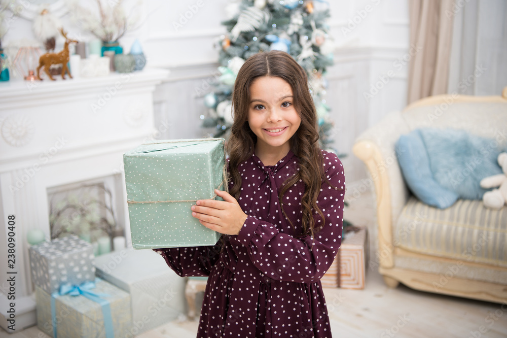 delivery christmas gifts. happy new year. happy little girl celebrate winter holiday. christmas time. Cute little child girl with xmas present. New Year is coming. What is inside