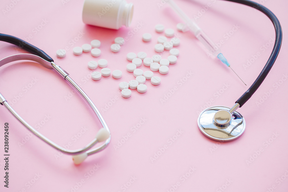 Fototapeta premium Close up of pills. Dietary supplements. Variety pills. Vitamin capsules on pink background