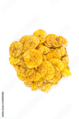 Pile of crunchy sliced dehydrated plaintain fruit chips