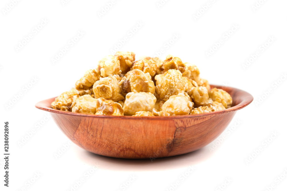 Handfuls of caramel popped popcorn kernels Handfuls of caramel popped popcorn kernels