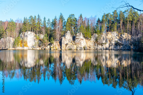 Natural lake in Adrspach rocks on sunny autumn day. Adrspach-Teplice sandstone rock town, Czech Republic. photo