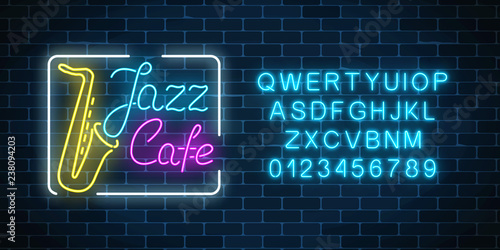 Neon jazz cafe and saxophone glowing sign with alphabet. Glowing street signboard of bar with karaoke and blues singers