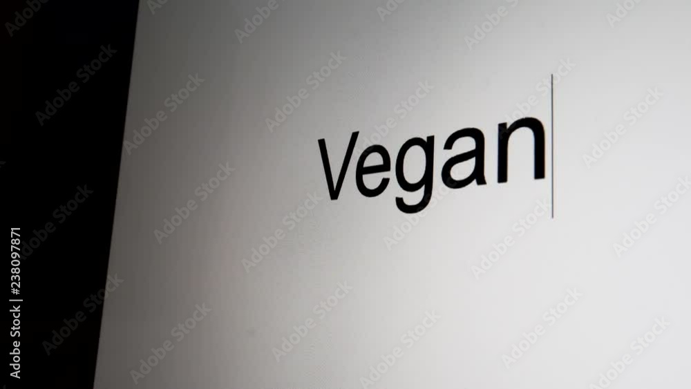 Typing Vegan on computer screen close up Typing Vegan on computer screen close up