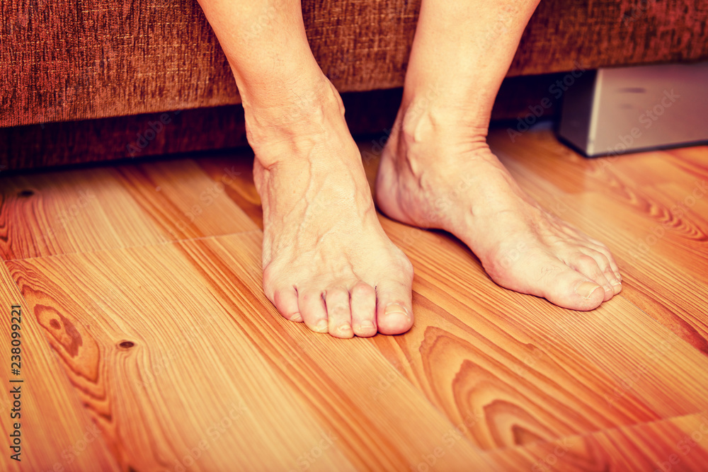 Feet of old woman on the floor Feet of old woman on the floor