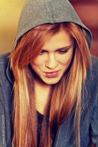 Teenage woman sitting stairscase and smoking photo