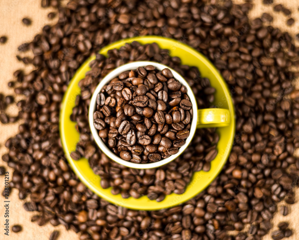 Brown roasted coffee beans, seed on dark background. Espresso dark, aroma, black caffeine drink. Closeup isolated energy mocha, cappuccino ingredient. Brown roasted coffee beans, seed on dark background. Espresso dark, aroma, black caffeine drink. Closeup isolated energy mocha, cappuccino ingredient.