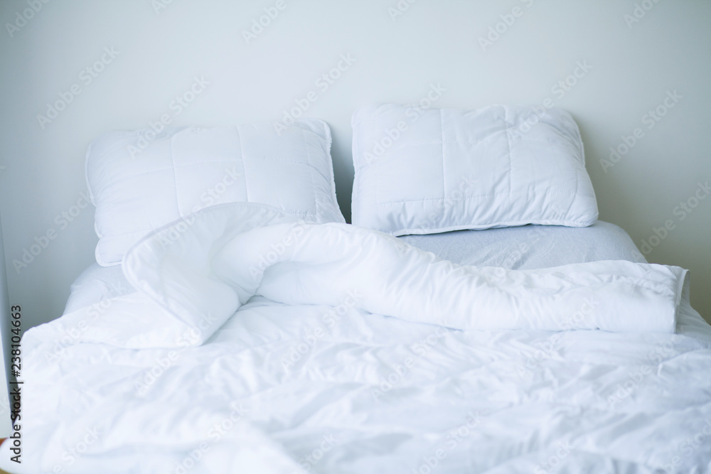 Good morning. Bed and pillows in white flat