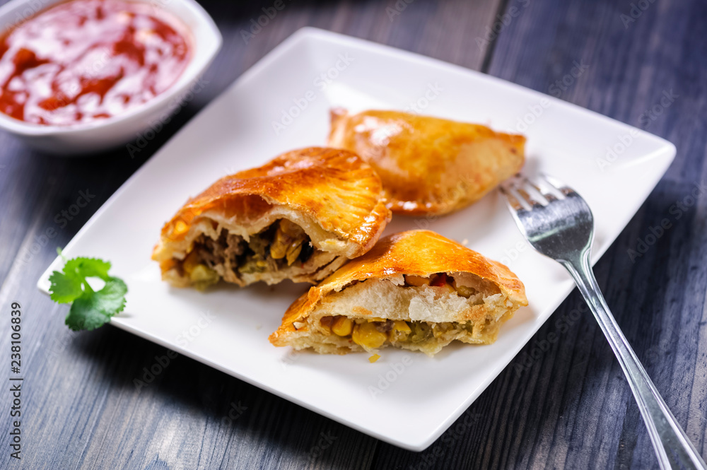 Empanada -dumplings stuffed with meat and vegetable. Empanada -dumplings stuffed with meat and vegetable.
