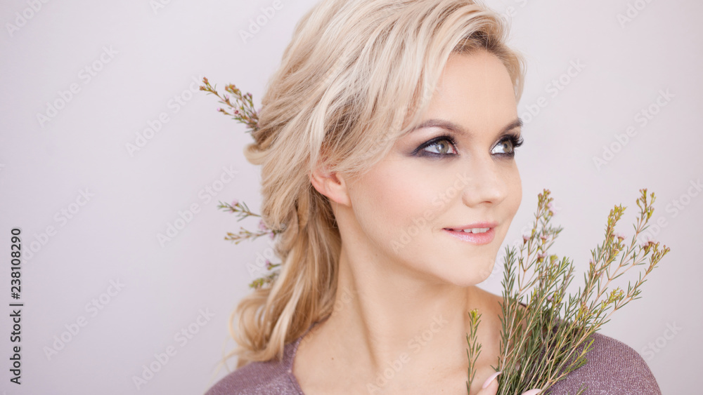 Naklejka premium Portrait of an elegant young woman with blond hair. Trendy hairstyle
