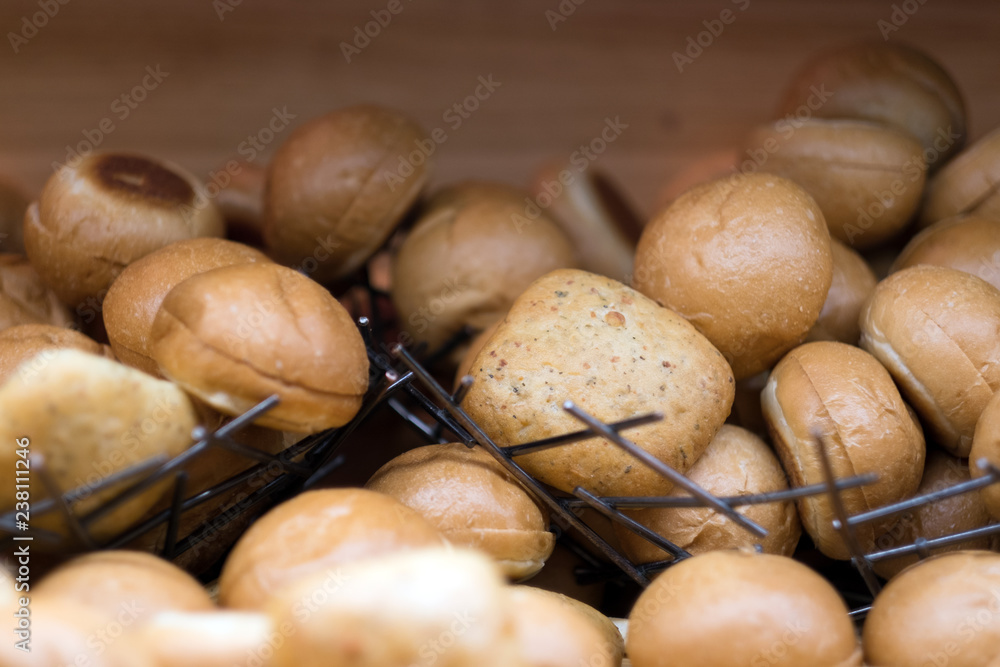 Pile of hot fresh bread bun comparing of whole wheat bun to plain bun for breakfast in the morning. Pile of hot fresh bread bun comparing of whole wheat bun to plain bun for breakfast in the morning.