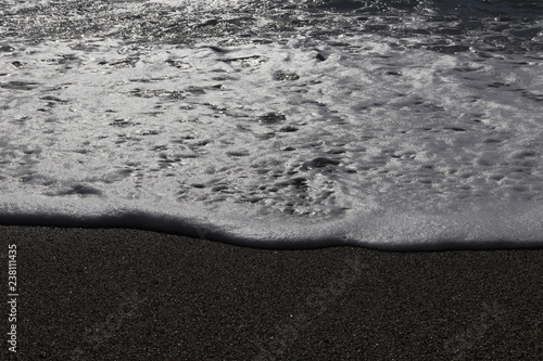 Fototapeta Naklejka Na Ścianę i Meble -  Sand beach with wave foam. Sea beauty background.