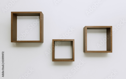 Empty Wooden shelves on white wall set of three © Ayman