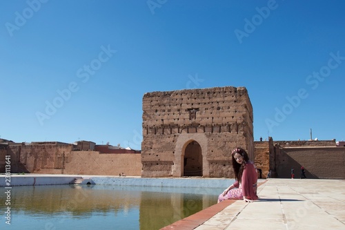 A lady smiling by a pond in Morocco photo