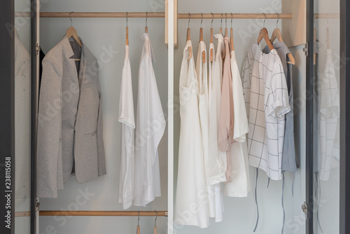 modern closet with clothes hanging on rail © 290712