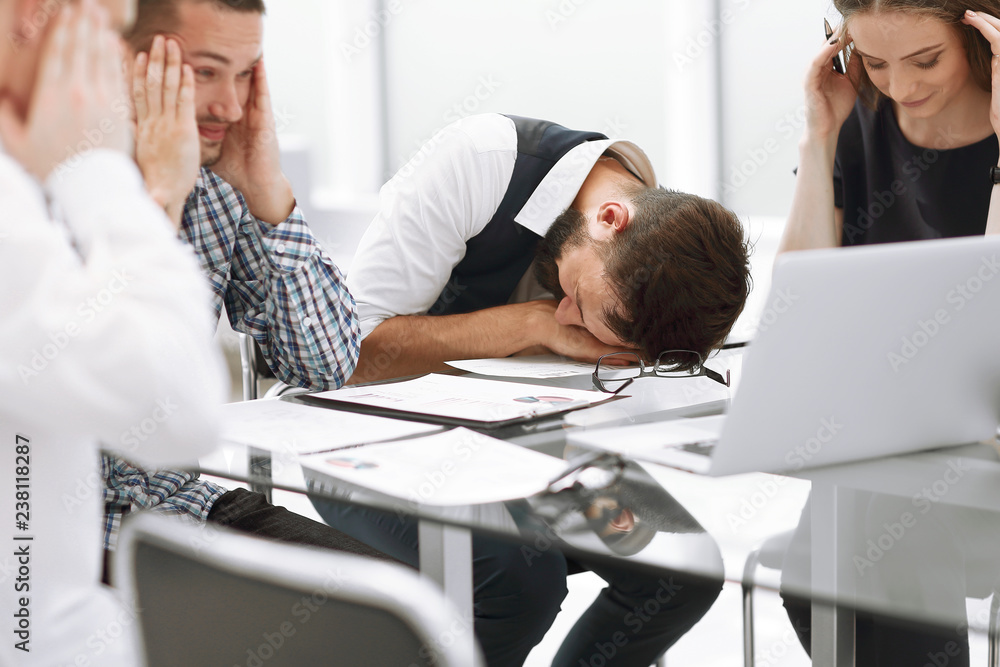 tired business team discussing the problems of a new startup.