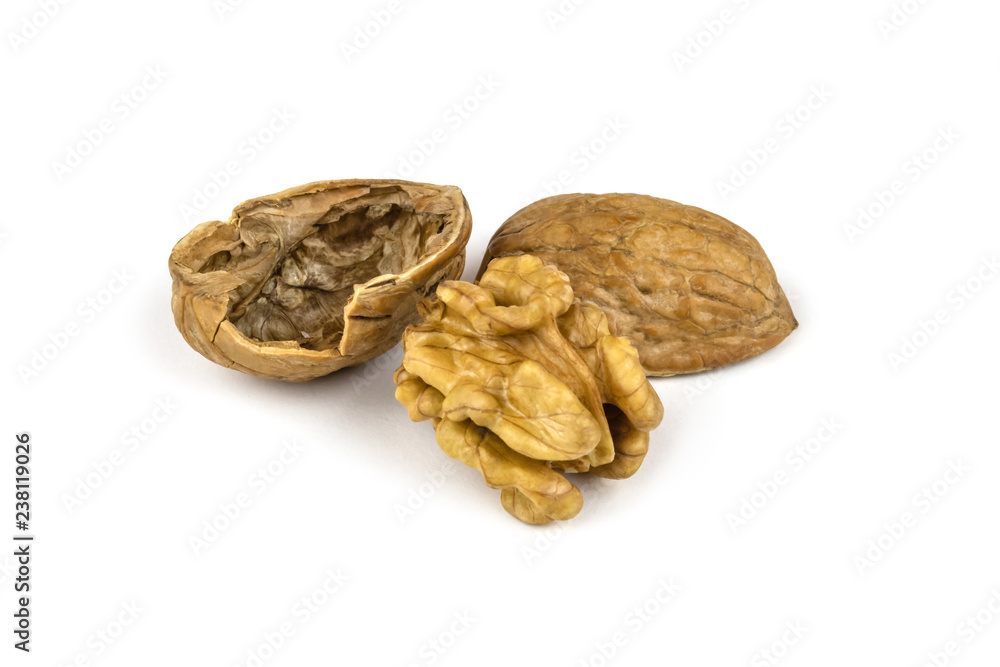 The core and shell of a walnut isolated on white background The core and shell of a walnut isolated on white background