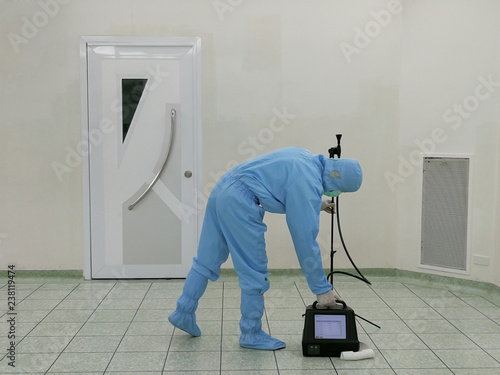 Inspector are testing dust inside the operating room with Particle Counter.