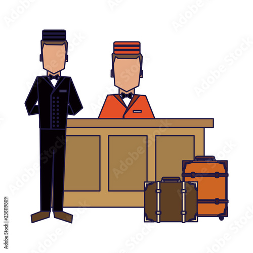 Bellboy with luggage at reception