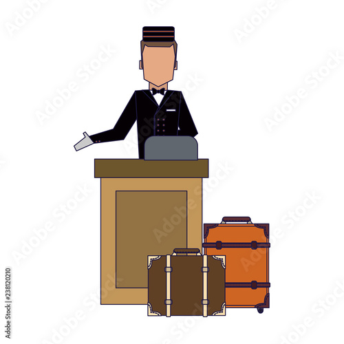 Bellboy with luggage at reception