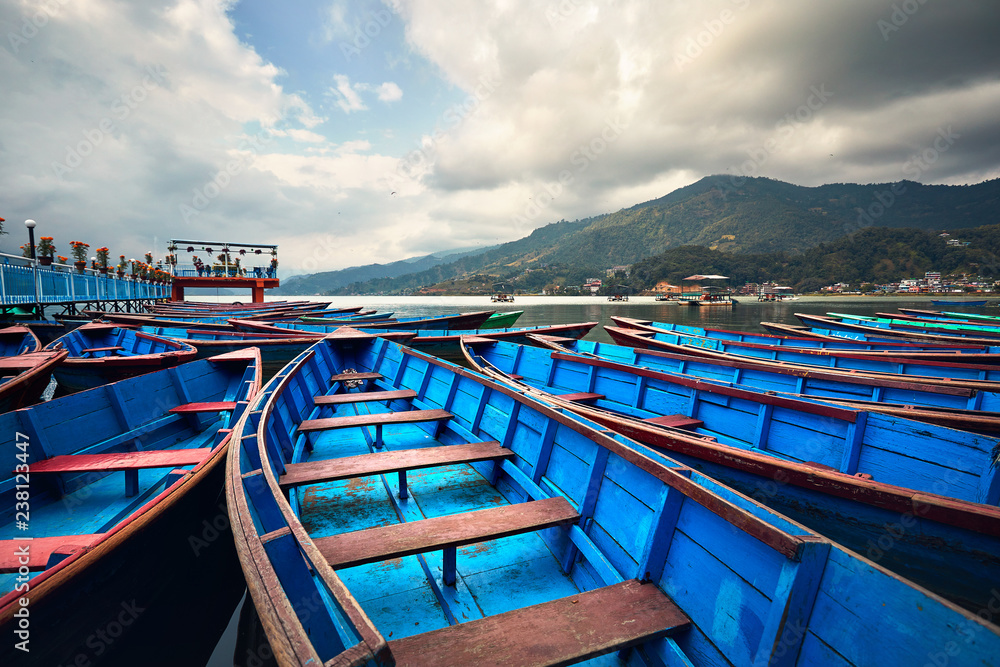 Blue wooden boats in Pokhara