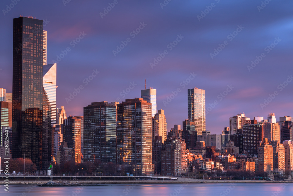 View on Midtown Manhattan  from east river at sunrise with long exposure