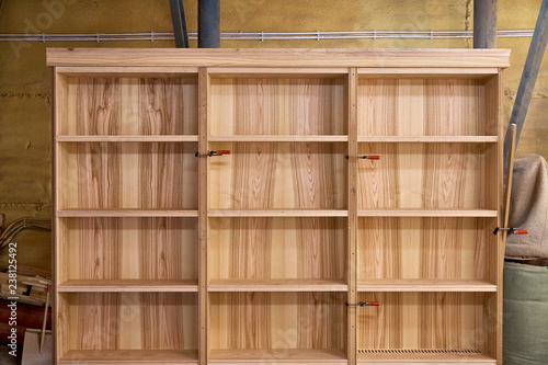 Ash bookshelves. Woodworking and carpentry production. Furniture manufacture.