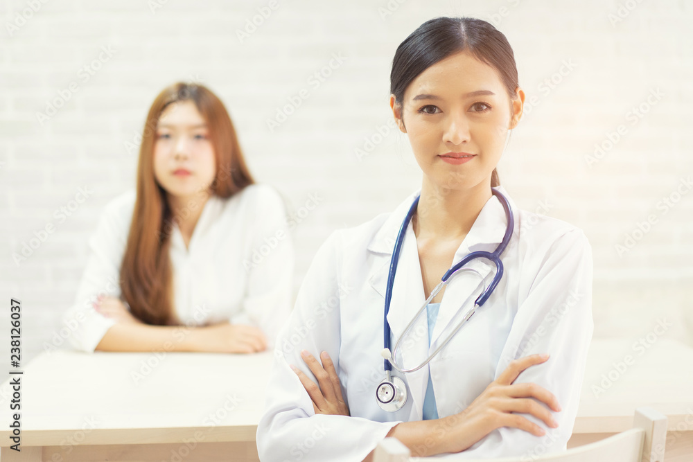 Female doctor talking to patient.Doctor and patient discussing something while sitting at the table . Medicine and health care concept. Doctor and patient Female doctor talking to patient.Doctor and patient discussing something while sitting at the table . Medicine and health care concept. Doctor and patient